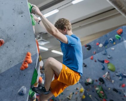 Person climbing on indoor rock wall
