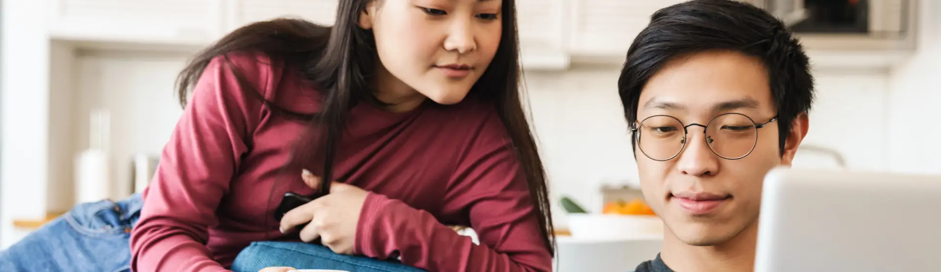 Young couple looking at laptop