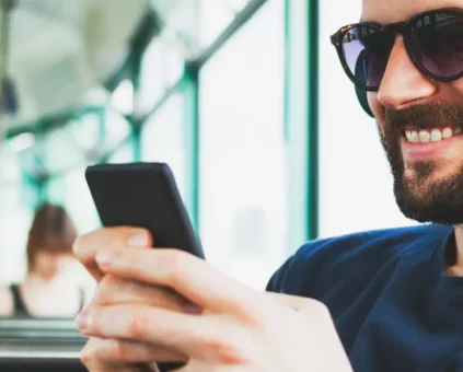 Happy Man checking credit score on mobile