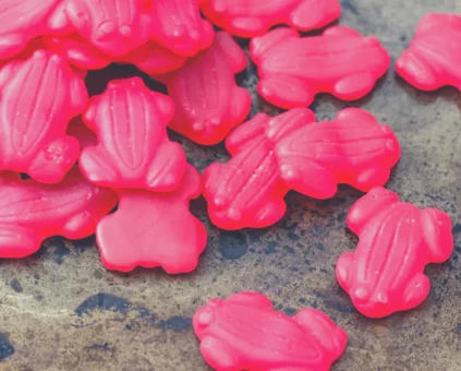 Pile of red frog lollies