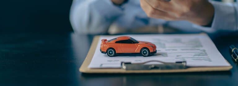 Person using their phone to apply for their bad credit car loan.