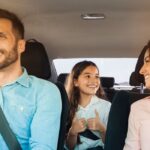 Happy family driving in car after securing a bad credit car loan