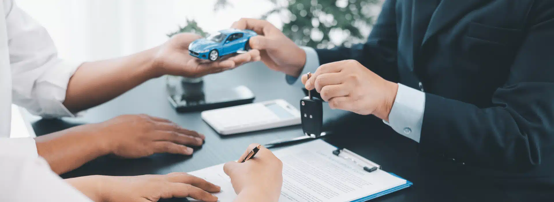 loan approval scene with documents and keys, illustrating bad credit car car loans