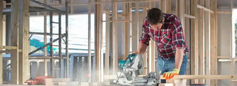 Hardworking tradesperson on-site representing support for bad credit and low‑doc car loan customers.